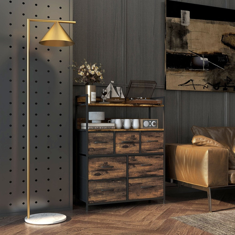 The chest of drawers in a bedroom setting next to a sofa and a record player