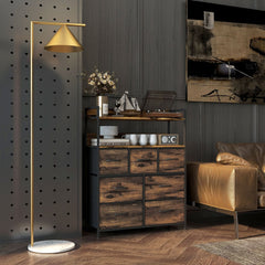 The chest of drawers in a bedroom setting next to a sofa and a record player
