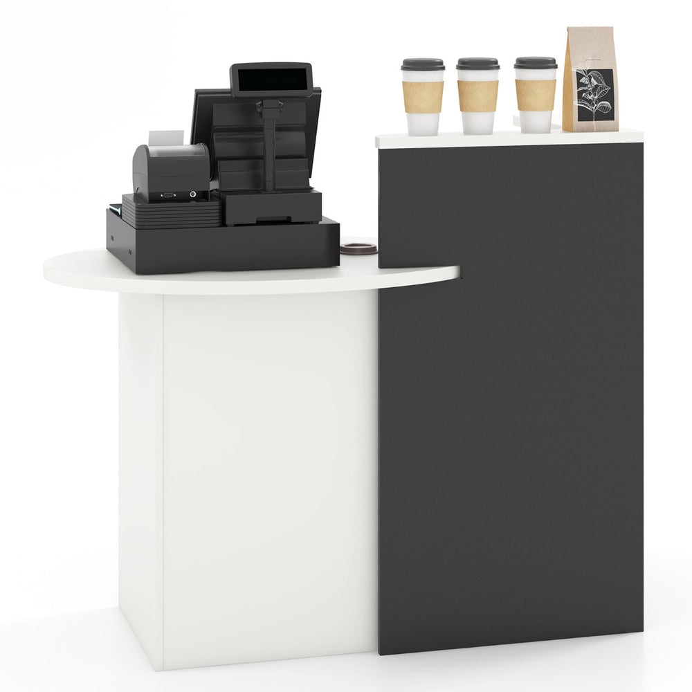 The reception desk shown from the side with a white tabletop and black base