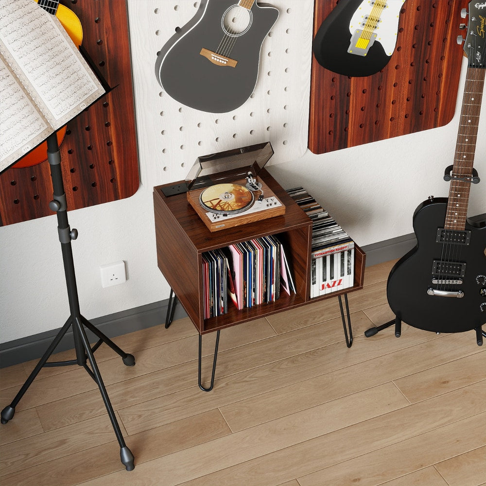 The turntable stand placed in a music room next to guitars and a music stand