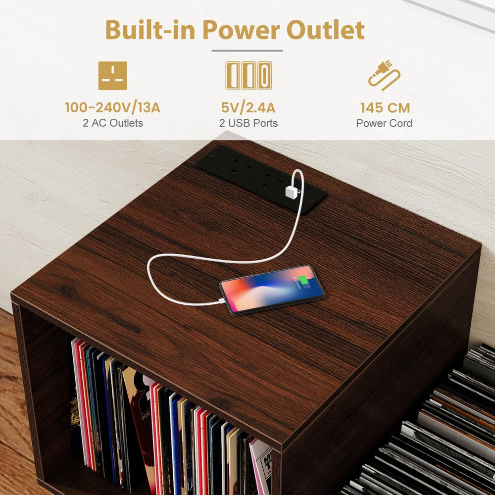 The turntable stand top surface showing the power outlet with a phone charging