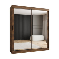 Sliding door wardrobe with mirrored doors reflecting a room setting