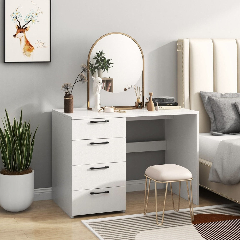 The white office desk is styled as a dressing table with a mirror and stool