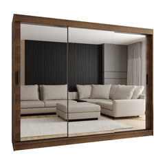 A dark wood sliding door wardrobe with large mirrors reflecting a sofa and living room