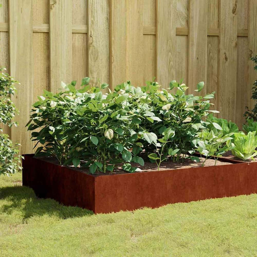 Garden Raised Bed Corten Steel in a garden setting with green plants growing inside