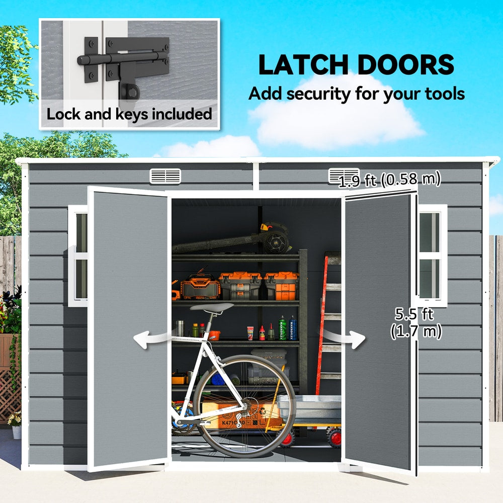 The lockable doors of the garden shed are open, showing a bicycle and shelves inside