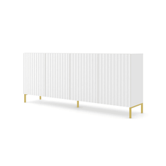 The white sideboard cabinet has a fluted front and stands on slim gold legs