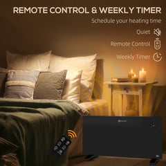 Black electric convector heater and remote control next to a bed, with text about timer