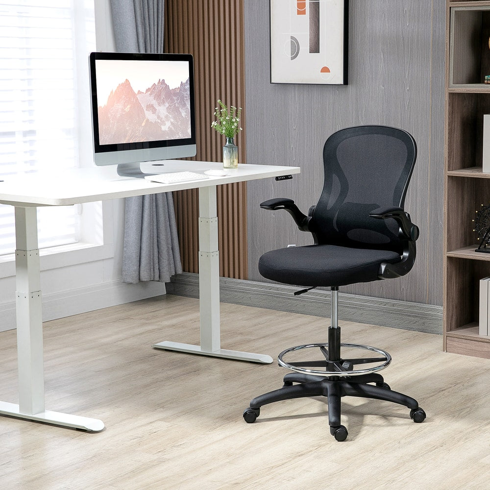 The office chair placed in a modern home office setting next to a white standing desk