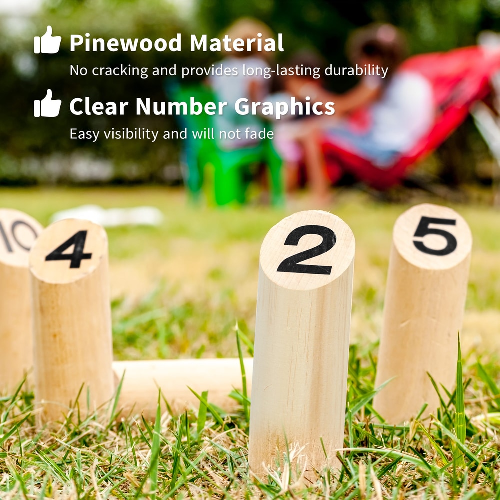 Close up of numbered wooden skittles in grass, showing clear graphics