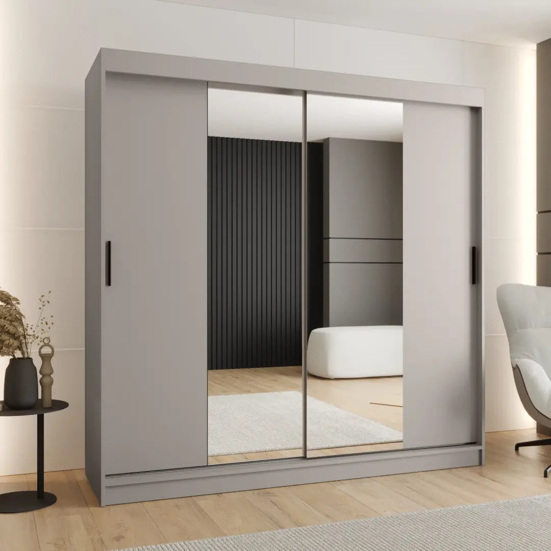 The sliding door wardrobe in a light grey finish with two central mirrored panels