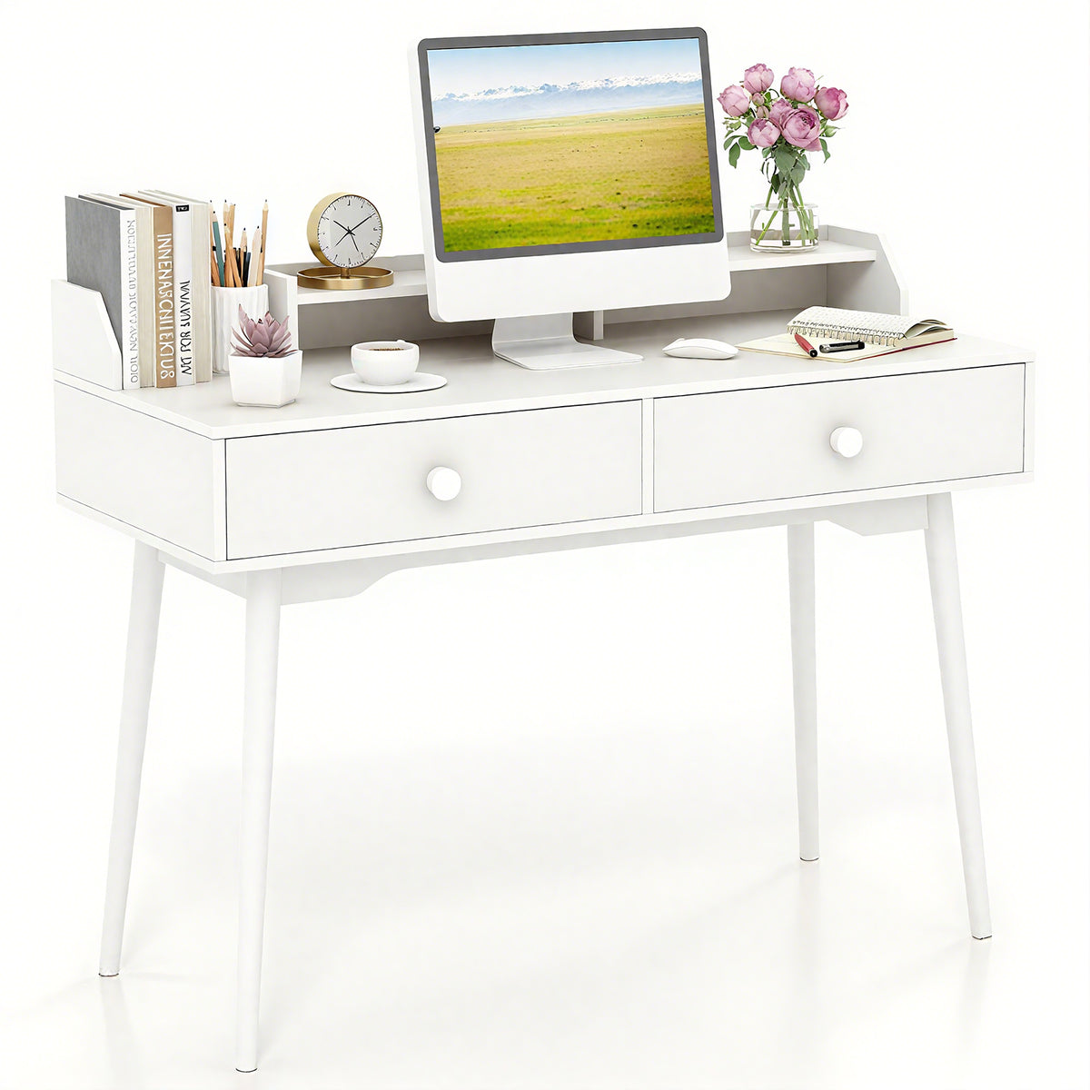 The office desk featuring a computer monitor and various desk accessories on top