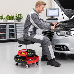 Mechanic using the rolling stool to work on a car engine