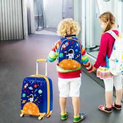 The kids luggage set being used by two children in a hallway