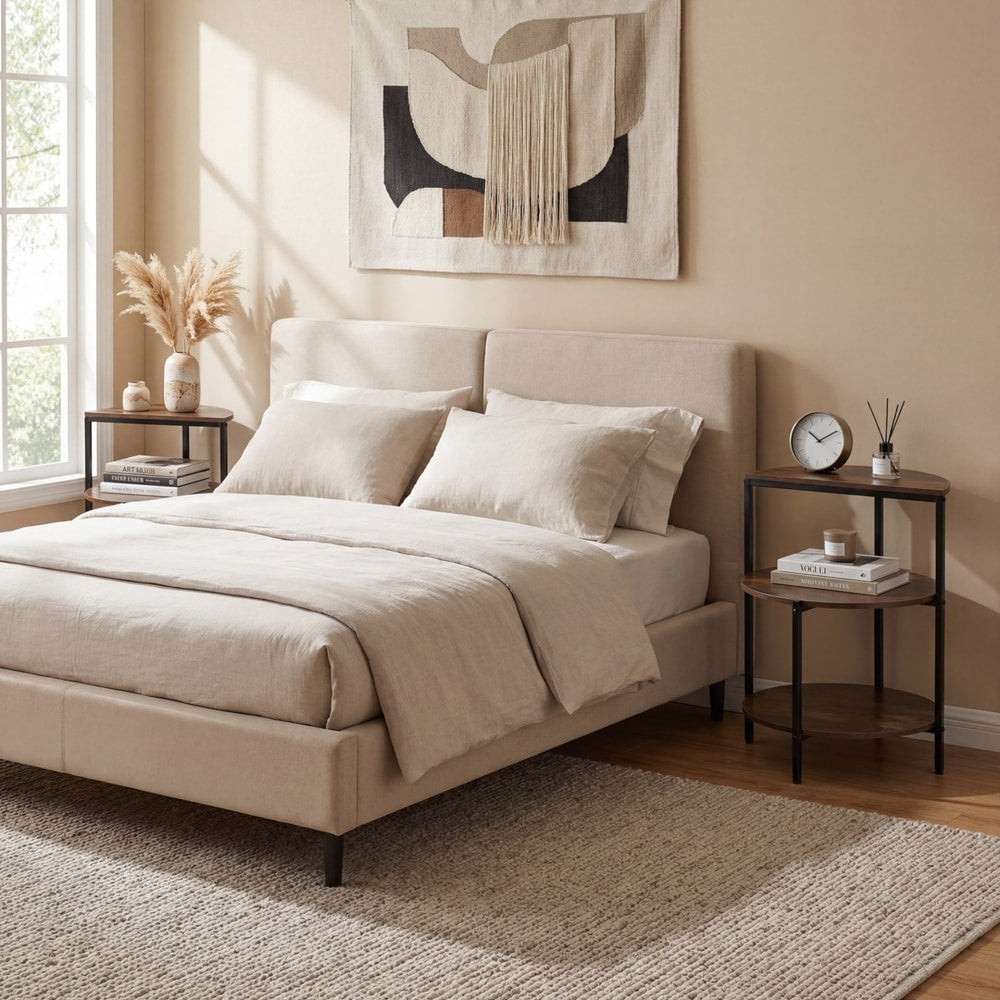 Rustic brown 3-tier round side tables next to a bed in a bedroom