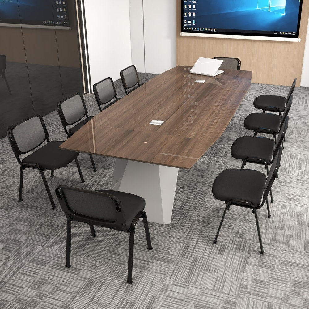 Black reception chairs around a large boardroom table