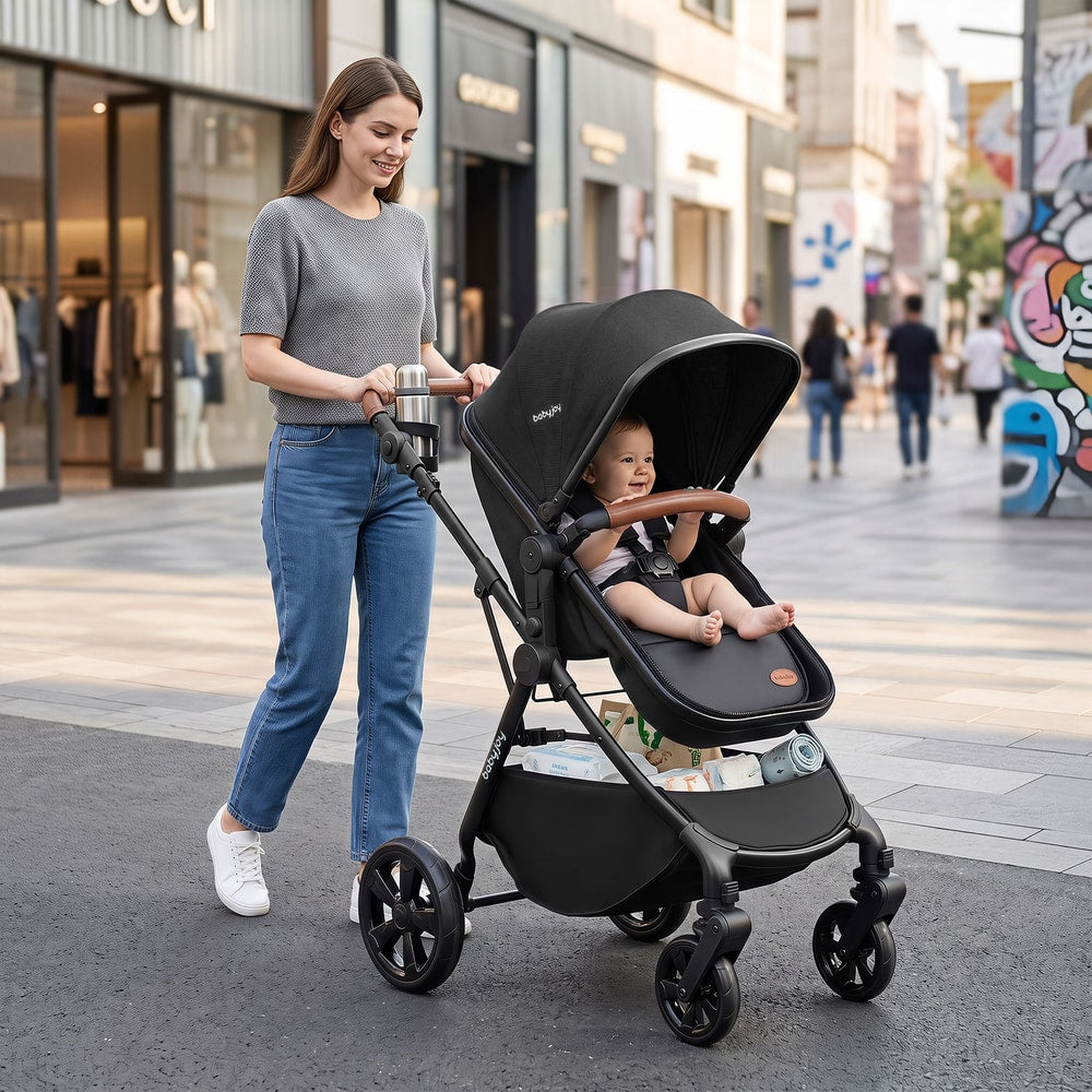 The baby stroller being pushed by a woman along a busy shopping street with a baby inside