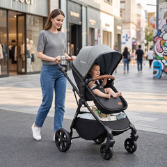 A woman pushes a baby in the high landscape convertible baby stroller on a pavement