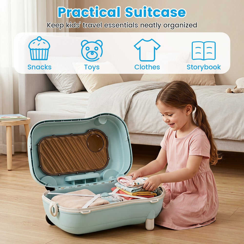 The kids luggage open on a bedroom floor with a girl packing clothes