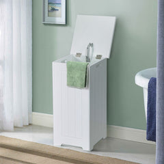 The laundry basket placed in a bathroom setting with a green towel draped over the edge