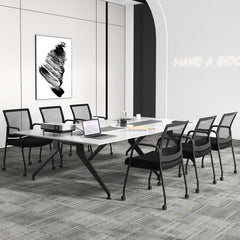 The office chairs positioned around a long conference table in a professional office