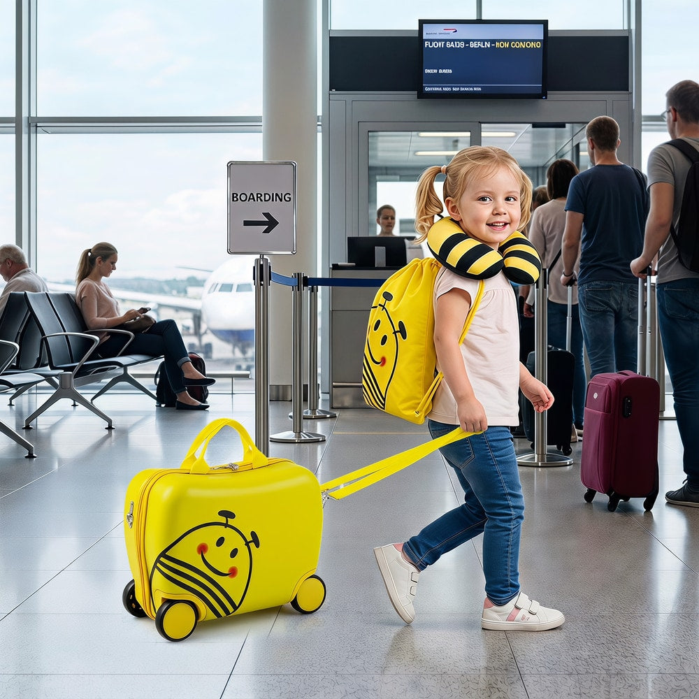 This yellow kids luggage set with a bee design is being pulled by a child
