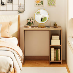 The office desk used as a vanity table with a mirror and flowers