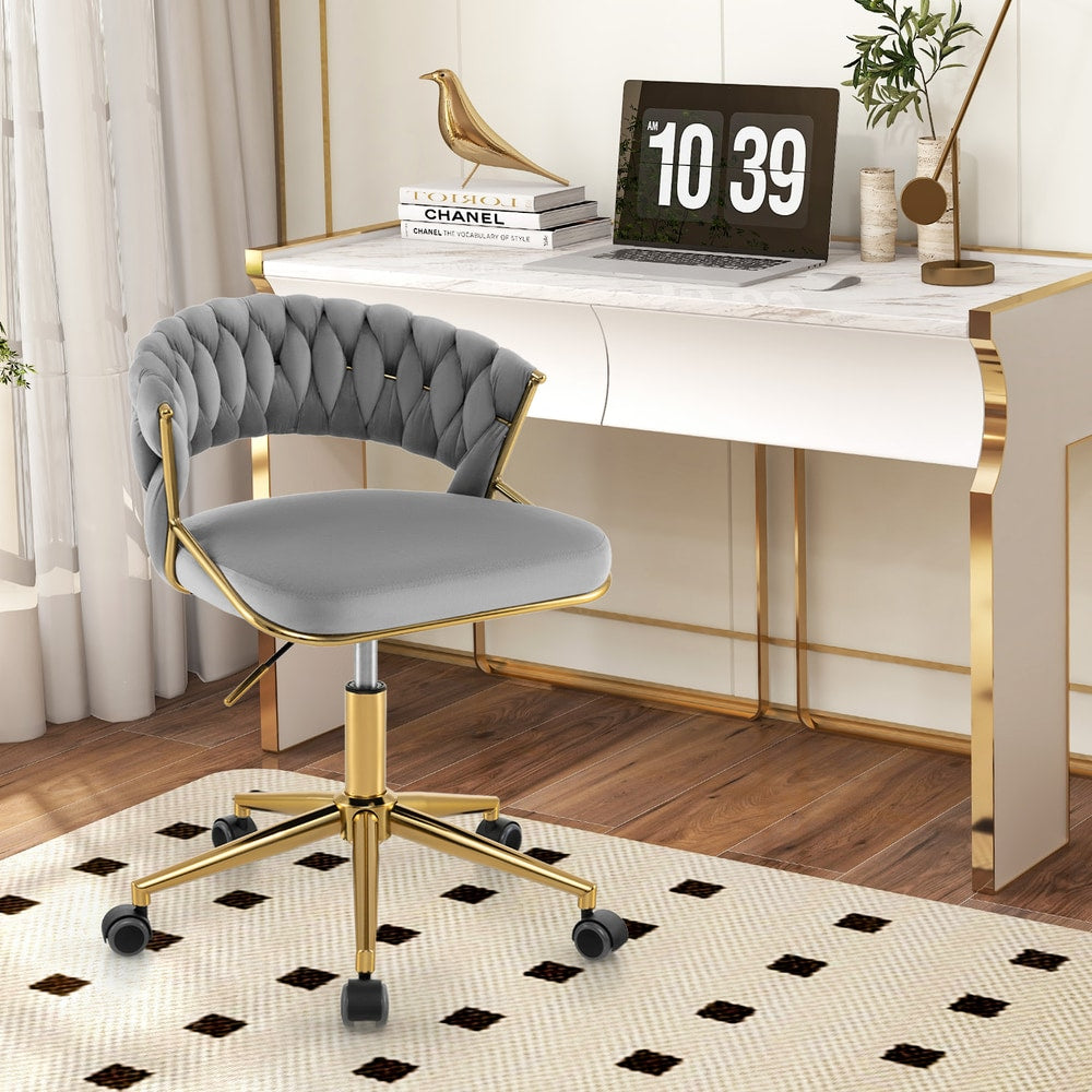Grey office chair with gold legs in a home office setting