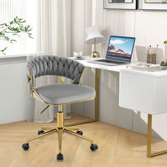Grey office chair with gold legs in a bright home office