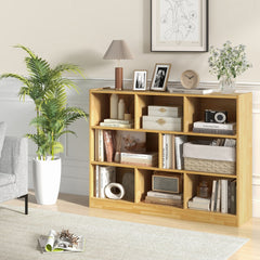 The wooden cube bookcase in a living room, styled with books and plants