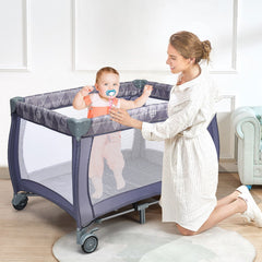 3 in 1 Convertible Bassinet Cot, the baby playpen in use with a mother playing with her child inside the mesh enclosure