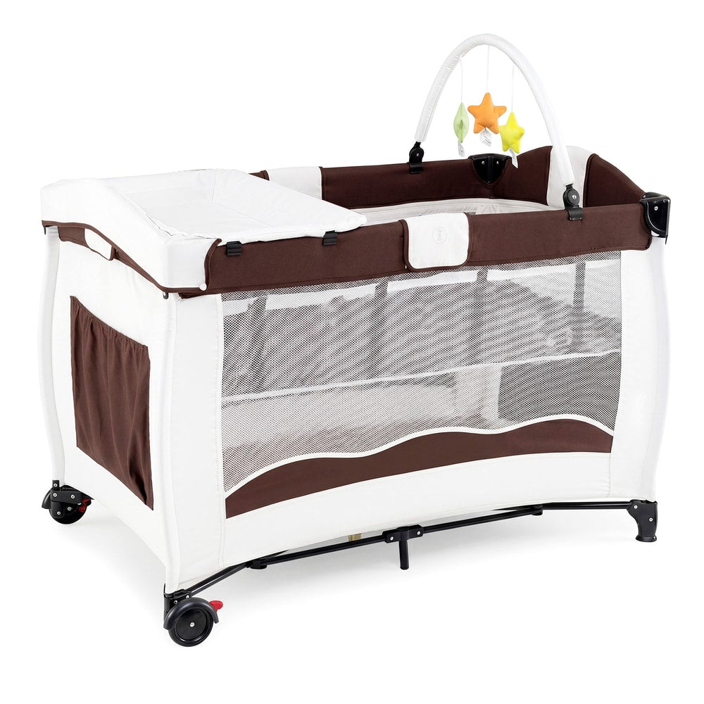 The brown and white baby playpen with wheels and a changing table attachment