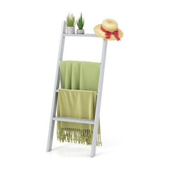 4-Tier Wooden Blanket Ladder with green throws and a straw hat on top