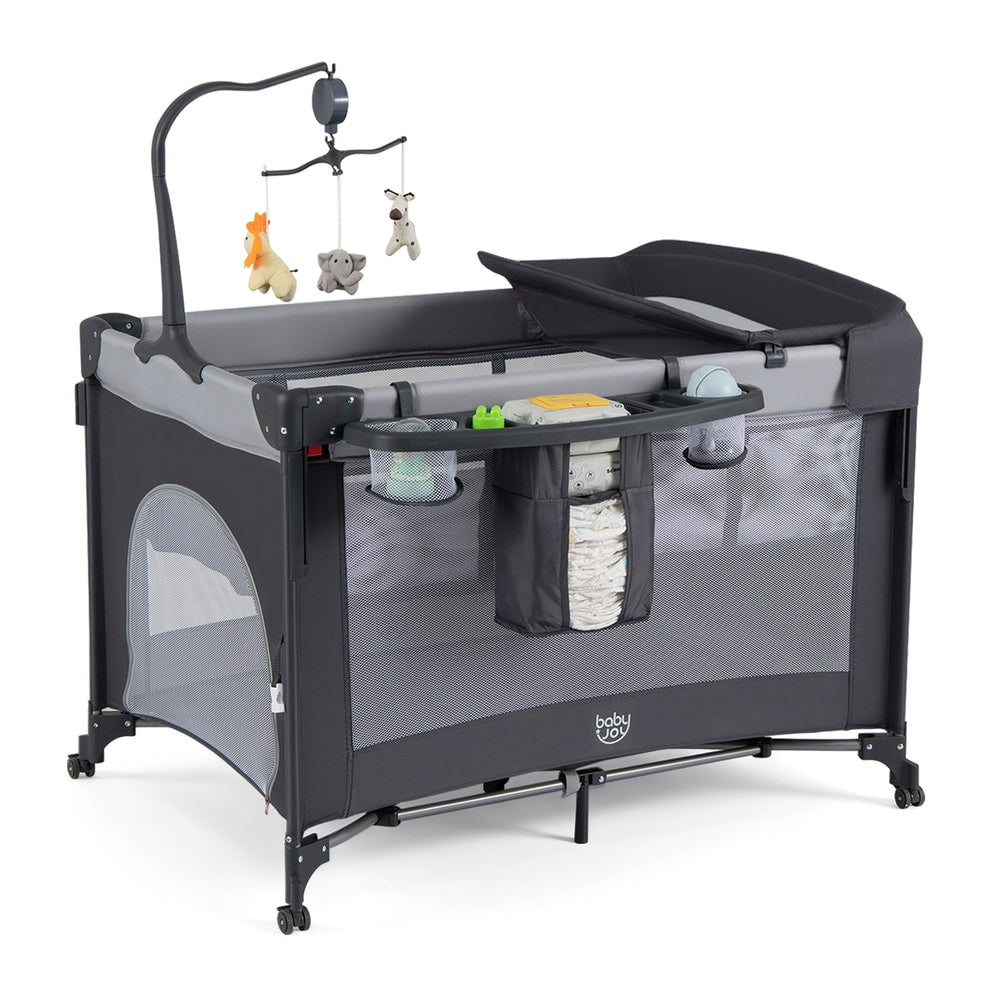 The bedside sleeper with a changing table, toy mobile and storage rack attached