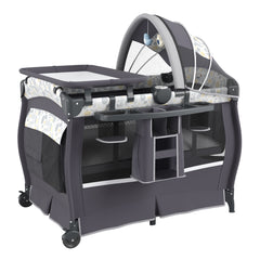 The portable bassinet showing the side storage organiser, canopy and changing table attachment