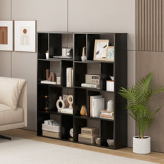 The display unit positioned against a wall in a modern interior with a sofa and a potted plant