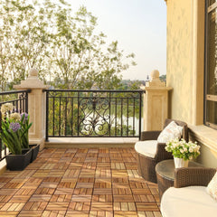 The wooden deck tiles installed on a balcony with outdoor furniture