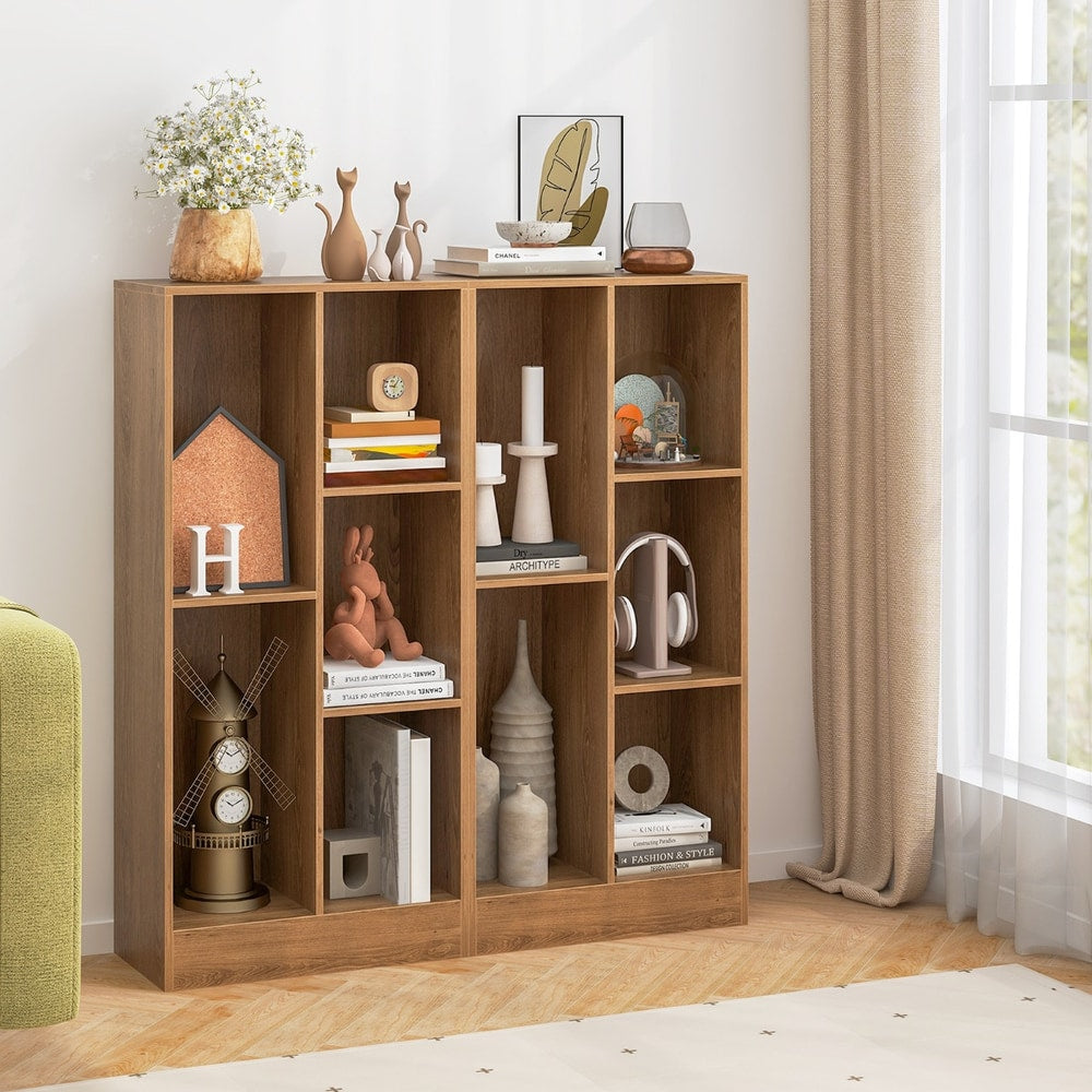 Two natural wood effect bookcases placed side by side, filled with various items