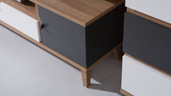 Close-up of the side of the kids TV cabinet showing the wood grain and dark grey door
