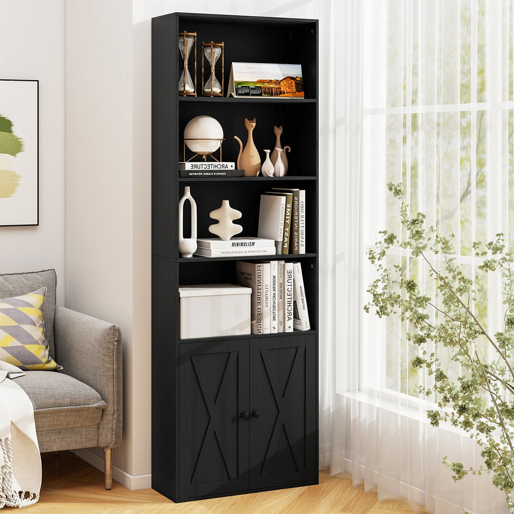 The tall bookcase placed in a bright living room next to a grey armchair by a window