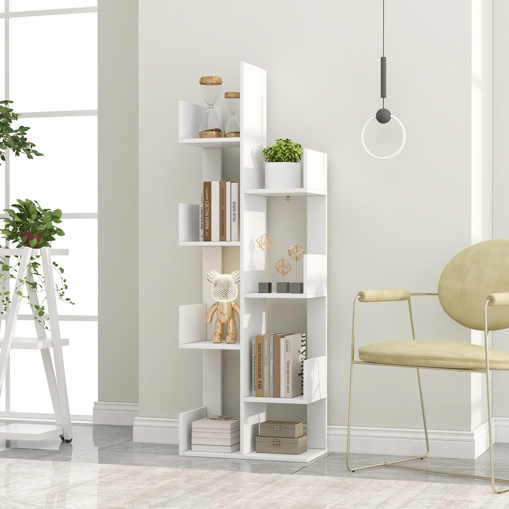 The tree shaped shelving unit displayed in a bright room next to a yellow chair