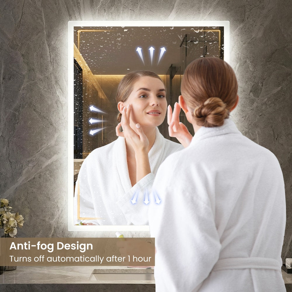 The bathroom mirror in use by a person with an illustration of the anti-fog function