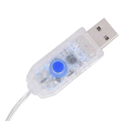 Close up of the USB connector and control button for the fairy lights