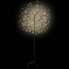 The cherry blossom Christmas tree with warm white lights illuminated against a dark background