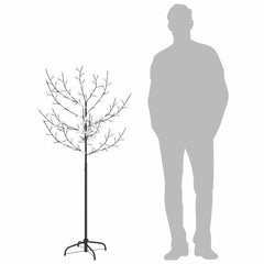The cherry blossom Christmas tree with a silhouette of a person to show scale