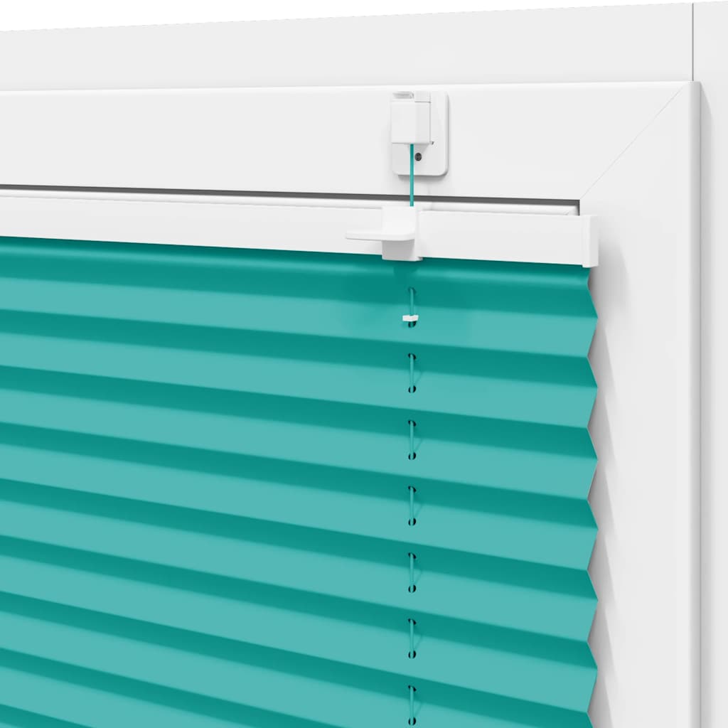 Close-up of the cord and handle mechanism of the petrol green pleated blind