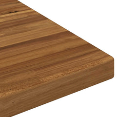 A close up of the rounded corner of the rectangular table top showing the smooth finish