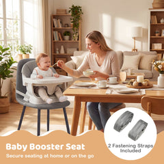 The grey baby booster seat is secured to a dining chair with fastening straps