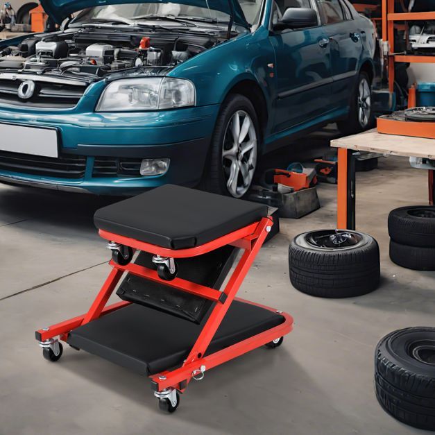 The creeper seat in its upright stool form next to a car