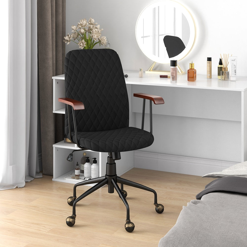 The office chair placed in a bedroom in front of a white dressing table with a round mirror